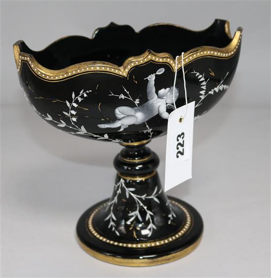 An enamelled black glass vase